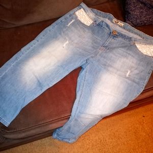 Distress light blue jeans with white lace crochet pockets